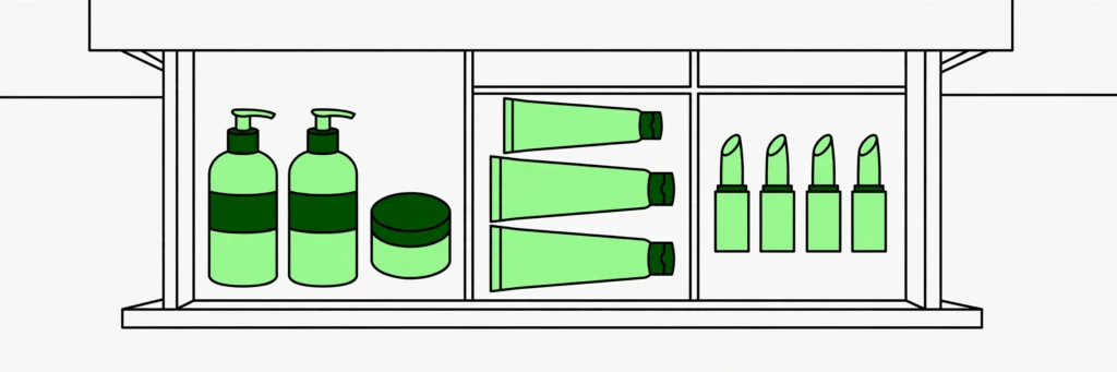 organized makeup and skincare products in small bathroom with drawer dividers